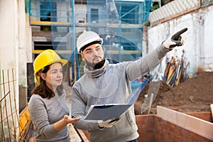 Engineers inspecting process of building overhaul