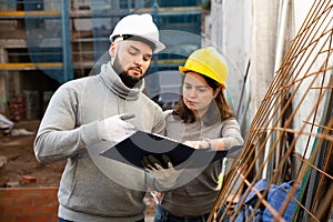 Engineers inspecting process of building overhaul
