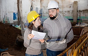 Engineers inspecting process of building overhaul