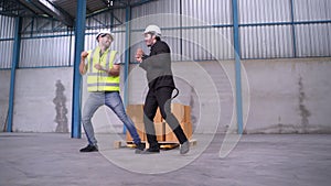 Engineers and INSPECTORS dance in the warehouse merrily.