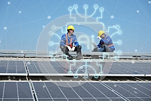 Engineers install solar cells on the roof of factory