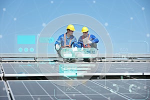 Engineers install solar cells on the roof of factory