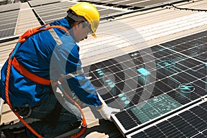 Engineers install solar cells on the roof of factory