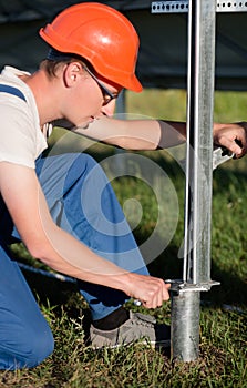 Engineers installing frame for solar panels.