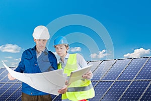 Engineers installing solar panels