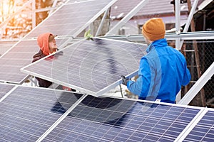 Engineers installing solar panels in winter