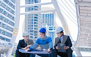 Engineers meeting at terrace on top of construction site. Coworkers discussing. Boss and worker argue. Conversation in team