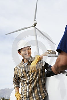 Engineers Near Wind Turbine At Wind Farm