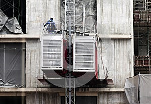 Engineers repairing elevators at construction site