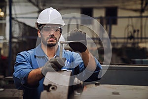 Engineers and skilled technicians are maintaining machinery. Technicians and engineers are working and repairing machines in photo