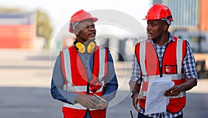 Engineers specializing in container yard management are working on outdoors. photo