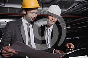 engineers in suits and hardhats working