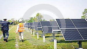 Engineers take investors on a tour of solar power plants. solar panels are an alternative electricity source to be sustainable