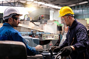 Engineers and technicians are solving problems caused by machines in industrial plants. Young man are working in factory plants