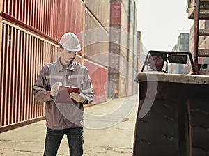 Engineers walking and checking condition Forklift container