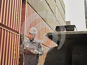 Engineers walking and checking condition Forklift container