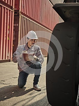 Engineers walking and checking condition Forklift container