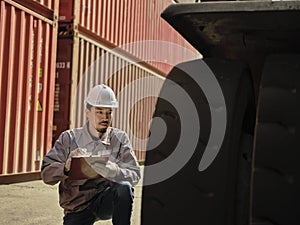 Engineers walking and checking condition Forklift container