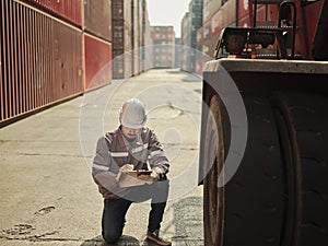 Engineers walking and checking condition Forklift container