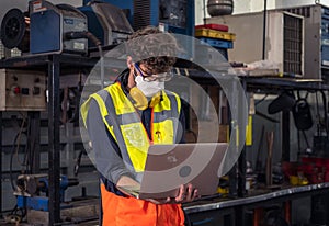 Engineers wear masks to prevent COVID-19 infection. While working in the factory