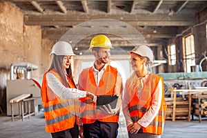 Engineers wearing safety helment meeting and discuss for work planning