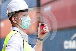 Engineers workers wear mask to prevent coronavirus and used radio communication