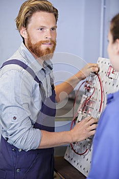 Engineers working with electrical system