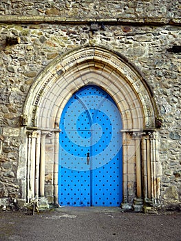 England: Cartmel Priory church blue door photo