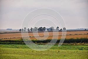 England lush pastures and farmlands in the United Kingdom. Beautiful English countryside with emerald green fields and meadows.