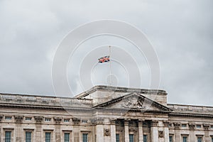 England mourning, half raised flag Union Jack on Buckingham Palace London UK