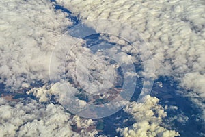 England rural landscape, fields, meadows and clouds. Aerial view from airplane of endless lush pastures and farmlands. Beautiful E