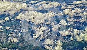 England rural landscape, fields, meadows and clouds. Aerial view from airplane of endless lush pastures and farmlands. Beautiful E