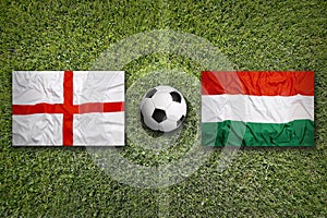 England vs. Hungary flags on soccer field