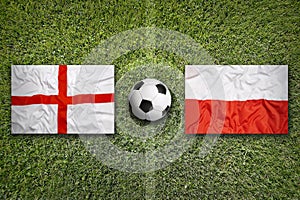 England vs. Poland flags on soccer field