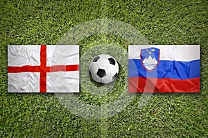 England vs. Slovenia flags on soccer field