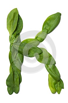 English alphabet from made from fresh green spinach leaves