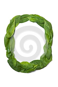 English alphabet from made from fresh green spinach leaves