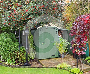 English back garden with Shed and lamp