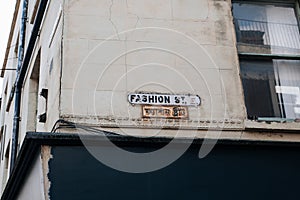 English and Bengali bilingual street name signs on Fashion Street in East London, UK