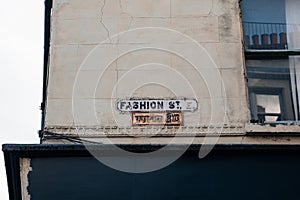 English and Bengali bilingual street name signs on Fashion Street in East London, UK