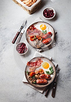 English breakfast on gray plates on white background