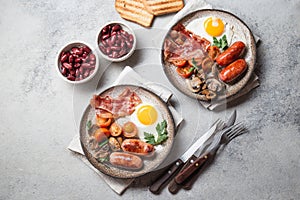 English breakfast on gray plates on white background