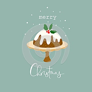 English Christmas pudding on cake stand glazed and decorated by holly. Traditional holiday dessert. Lettering Merry Christmas