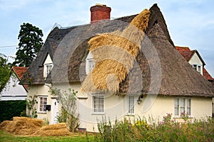 English Cottage being thatched