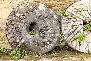 English cottage and old stone wheels