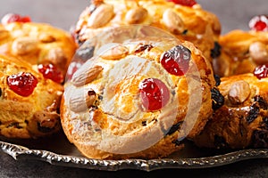 English Fat Rascals scones with dried fruits and almonds close-up in a plate. horizontal
