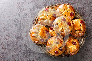 English Fat Rascals scones with dried fruits and almonds close-up in a plate. horizontal top view