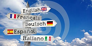 English, French, German, Spanish, Italian - wooden signpost with five arrows