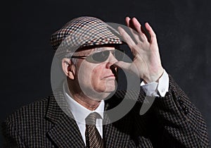 English gentleman in sunglasses and tweeds