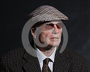 English gentleman in sunglasses and tweeds